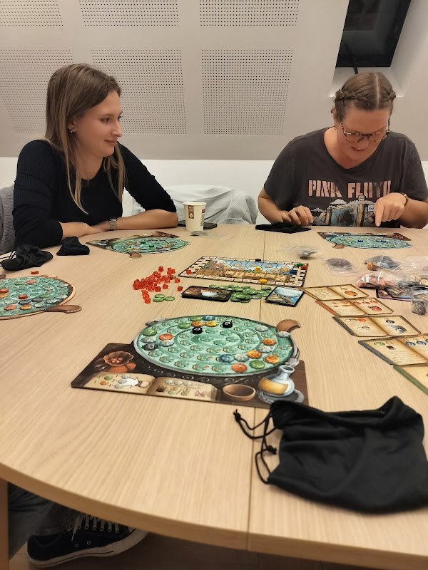 People playing board games